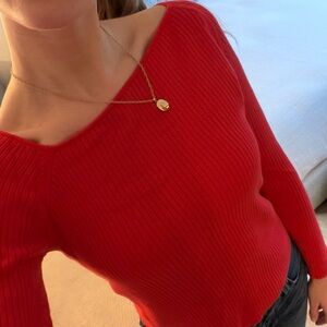 Red asymmetrical neckline sweater